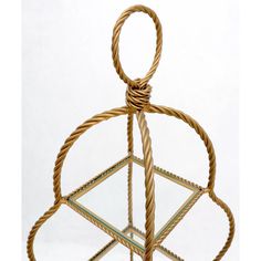 a glass and metal object with a knot around it's neck, on a white background