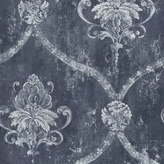 an old, grungy wallpaper with white and grey designs on black background