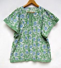 "ITEM DESCRIPTION green blue printed blouse tops - split neckline Indian style blouse - short sleeve blouse Features : short sleeve, Henley neck, Blouse Material : Cotton cambric Fabric: 100% cotton soft light weight ethnic print fabrics Sleeve Length = 9 inch For more sizes & their measurement, please refer our below chart to understand the sizes variations available with us For your size requirement, please mention your size in seller note at the time of buying. IMPORTANT NOTE: - SIZE MEASUREM Green Half Sleeve Tops For The Beach, Green Half Sleeve Summer Tops, Green Half-sleeve Top For Vacation, Green Half Sleeve Tops For Vacation, Green Half Sleeve Top For Vacation, Casual Green Split Neck Top, Green Half Sleeve Blouse For Summer, Green Printed Half Sleeve Tops, Green Printed Half Sleeve Blouse