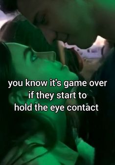 a man kissing a woman with the caption you know it's game over if they start to hold the eye contact