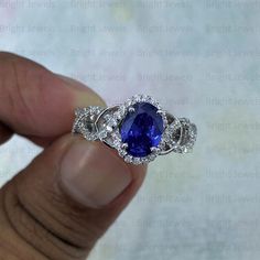 ITEM DESCRIPTION ✦ Handmade, high-quality item! ✦ Material: SOLID 925/10/14K GOLD (can be made in Silver/white/rose/yellow gold) ✦ Center stone: Blue Sapphire ( Lab Created) ✦ Side Stone: Simulated Diamond ✦ Center Stone Size: 9x7mm Oval ✦ Stone Weight: 2.50TCW ✦ Cut - Excellent ✦ Color: Blue ✦ Clarity: VVS1 ✦ Mohs Hardness: 9.25 ✦ Certification: On Request ✦ Metal Weight: 4.5 Gram Approx ✦ Style: Halo ✦ Setting: Prong ✦ Hallmark: 925/10K/14K Stamp ✦ Country of Manufacture: India ✦ Condition: Br Gia Certified Oval Tanzanite Diamond Ring, Gia Certified Oval Sapphire Ring, Oval Tanzanite Diamond Ring As A Gift, Oval Tanzanite Diamond Ring For Gift, Gia Certified Oval Tanzanite Ring, Gia Certified Tanzanite Oval Rings, Oval Sapphire Ring With Halo Setting In Moissanite, Oval Sapphire Ring With Moissanite Halo Setting, Oval Sapphire Moissanite Ring With Center Stone