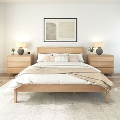 a large bed sitting in a bedroom next to two nightstands