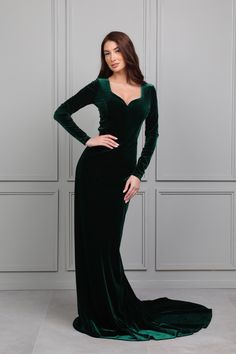 a woman in a green velvet gown