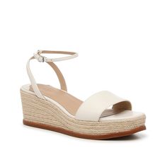 Lauren Ralph Lauren-Leona Wedge Sandal The Leona sandal is the perfect pair for spring and summer soirées! This wedge from Lauren Ralph Lauren is crafted with luxe suedematerial , features a delicate ankle strap, and braided espadrille details. Elegant Wedge Sandals With Heel Strap For Vacation, Elegant Wedge Sandals With Ankle Strap For Vacation, Elegant Ankle Strap Wedge Sandals For Vacation, Spring Cream Wedge Sandals With Block Heel, Cream Block Heel Wedge Sandals For Spring, Elegant Block Heel Wedge Sandals For Vacation, Elegant Wedge Heel Sandals For Spring, Cream Wedge Sandals With Heel Strap For Spring, White Wedge Sandals With Heel Strap For Spring