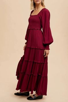 The Merlot Peasant Tiered Maxi Dress features long sleeves, square neck bodice, and a lined skirt. The style is ageless and can be worn casually or for more elegant affairs. Fabric: SELF: 100%VISCOSE LINING: 100%POLYESTER Long Sleeve Solid Maxi Dress For Brunch, Long Sleeve Maxi Dress For Brunch, Solid Long Sleeve Maxi Dress For Brunch, Bohemian Long Sleeve Dress With Elastic Sleeves, Fall Long Sleeve Dress With Gathered Bishop Sleeves, Fall Long Sleeve Lantern Dress With Elastic Sleeves, Fall Lantern Sleeve Long Dress With Elastic Sleeves, Fall Lantern Sleeve Long Dress, Fall Long Sleeve Maxi Dress With Ruffles