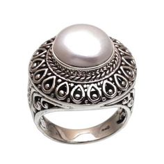 Beautifully elegant this wonderful cocktail ring is crafted by talented artisan Made Sugi. Crafted expertly by hand from sterling silver the ring features a gorgeous cultured mabe pearl that glows magnificently from a bezel setting. The lovely silver-white gem is enveloped by traditional Balinese bun and jawan floral openwork that accentuates the feminine appeal of the ring. Pearl Cocktail Ring, Silver Link Bracelet, Mabe Pearl, Dragon Necklace, Sterling Silver Dangle Earrings, Pearl Earrings Dangle, Women Artisans, Silver Pieces, Balinese