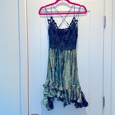 Go For Boho Glam In This Creation From Free People, A Flowing Slip Dress With A Crochet At The Bodice And An Asymmetrical Ruffled Hem. V-Neck; Fit & Flare Silhouette Pullover Style Adjustable Spaghetti Straps Cross At Back Crochet Top; Asymmetrical Ruffled Hem; Smocked Back Green Flowy Dress With Lace Trim, Flowy Green Dress With Lace Trim, Bohemian Lace Dress With Ruffle Hem, Bohemian Midi Dress With Crochet Trim For Summer, Green Bohemian Mini Dress With Ruffle Hem, Bohemian Green Mini Dress With Ruffle Hem, Vacation Lace Midi Dress With Ruffles, Lace Midi Dress With Ruffles For Vacation, Green Lace Mini Dress For Summer