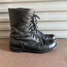 "Bates Floataways combat boot in a black leather with lace up on front. Thick rubber soles.  Condition is good. Used condition with scuffs. No breaks or tears. Lots of wear left on heels and soles. Size 13 on inside. at least that's what it looks like. It is faint but I just listed a size 12 boot and it is slightly bigger. Please look at measures. Length outside from wall: 12 7/8\" Width outside bottom: 4 1/2\" Total height in back: 10 3/8\" Heel: 5/8\" Boot height: 9\"" Black Rugged Lace-up Boots With Plain Toe, Black Rugged Combat Boots With Rubber Sole, Rugged Black Combat Boots With Rubber Sole, Vintage Lace-up Boots With Leather Footbed, Rugged Black Lace-up Boots With Rubber Sole, Leather Combat Moto Boots With Reinforced Toe, Military Combat Boots With Reinforced Toe, Black Combat Lace-up Boots, Leather Steel Toe Combat Boots