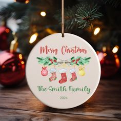 a personalized christmas ornament hanging from a tree