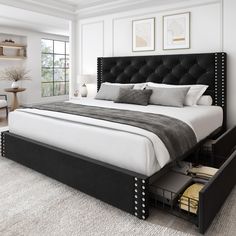 a bedroom with a large bed and drawers in it