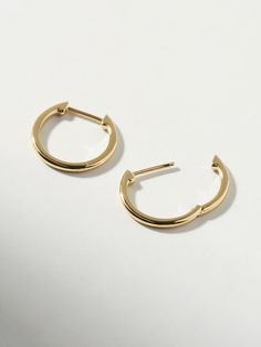 Classic, polished and minimalist-chic, these small slim endless hoops are perfect for everyday wear. Crafted in recycled Sterling Silver and dipped in 14K gold, these hoops come with an endless hoop closure for comfort and ease. Lightweight and hypoallergenic, these small slim endless hoops add a dainty touch to your earring stack. This design is also available in a medium size. • Hypoallergenic hoop earrings crafted in recycled Sterling Silver• High-polish, smooth 14K gold finish • Lightweight, Earring Stack, Bday Gift, Outfit Plan, Minimalist Chic, Earring Crafts, Letter Necklace, Precious Metal, Recycled Sterling Silver, Gold Finish