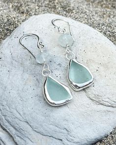 These Cornish sea glass earrings were made by me, using eco friendly (recycled) silver and beautifully smooth sea glass found on my local beach on the south coast of Cornwall near Fowey.  Pair 1: Aqua seaglass and moonstone (approx 5cm long) Pair 2: light sage green sea glass and flashy labradorite (approx 4.5cm long) Pair3: aqua sea glass and Iolite (approx 4.5cm long)  All my jewellery is sent out beautifully wrapped and boxed in my branded packaging :) Handmade Silver Sea Glass Earrings, Handmade Silver Earrings With Sea Glass, Silver Teardrop Sea Glass Jewelry, Nickel-free Teardrop Recycled Glass Jewelry, Silver Sea Glass Dangle Earrings, Silver Hypoallergenic Sea Glass Earrings, Silver Hypoallergenic Earrings With Sea Glass, Hypoallergenic Silver Sea Glass Earrings, Seaglass Earring