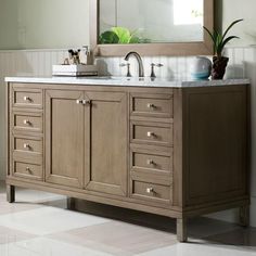 a bathroom vanity with a mirror above it