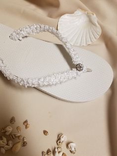 "Very simple Flat wedding sandals flipflop style 1/2\" heel. Very dressy and simple please look at the pictures. Sizes: Small: 5.5 - 6.5 Medium: 7-8 Large: 8.5 - 9.5, X-Large: 10 - 11 Please contact for any questions ON SIZING, or ANY other concerns. FINAL SALE, NO RETURNS, NO EXCHANGES, NO EXCEPTIONS." White Single Toe Strap Sandals For Beach, Adjustable Single Toe Strap Flip Flops For Beach, Adjustable White Flip Flops For Beach Season, White Toe Strap Sandals For Summer, Handmade White Barefoot Sandals For Beach, White Single Toe Strap Sandals For Summer, Adjustable Ankle Strap Flip Flops For Beach Season, Adjustable Ankle Strap Flip Flops For Vacation, Elegant Flip Flops For Summer Beach