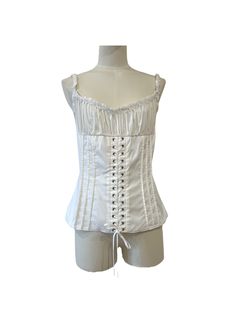 White cotton bustier top. Curling on the bust and laces on the front. Functional opening on the back with zip. Small lace border on the neckline and straps. Condition Details New with tag Size and Material 44 IT | L White Corset With Built-in Bra And Tank Straps, Fitted Cami Corset With Lace Trim, White Summer Corset With Corset Back, White Summer Corset With Adjustable Straps, White Corset With Adjustable Straps For Summer, White Adjustable Straps Summer Corset, White Lace-up Corset With Fitted Bodice, White Corset With Adjustable Straps And Fitted Bodice, White Boned Bodice Corset For Spring