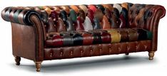 a leather couch with many different colors on it