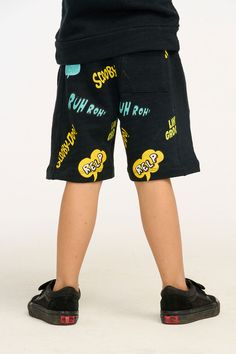 Let your son be the coolest kid on the block in these one-of-a-kind Scooby Doo shorts! The linen French jersey fabric and stylish Shadow Black color are already a win, but the front and back graphics of Scooby and his cool catchphrases are the icing on the cake! Complete the look with a matching top and sneakers and he'll be groovin' all day long. Model is wearing a size 6T Fabric Content: 50% Cotton 50% Modal Imported Style: CB1217-SCY006-SHDW Hip Hop Bottoms With Letter Print For Summer, Hip Hop Summer Bottoms With Letter Print, Hip Hop Graphic Print Bottoms For Summer, Graphic Print Hip Hop Bottoms For Summer, Hip Hop Style Graphic Print Bottoms For Summer, Playful Shorts With Pockets, Summer Cotton Bottoms With Graffiti Print, Casual Graphic Print Shorts For Playwear, Summer Casual Bottoms With Cartoon Print