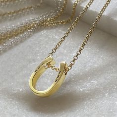 Classique Horseshoe & Chain Necklace - www.urban-equestrian.com Horseshoe-shaped Jewelry With Adjustable Chain, Gold Horseshoe Jewelry With Adjustable Chain, Classic Horseshoe Jewelry, Gold Horseshoe Necklace With Adjustable Chain, Gold Horseshoe Necklace For Gift, Classic Horseshoe Gold Necklace, Everyday Gold Horseshoe Necklace, Elegant Gold Horseshoe Jewelry, Classic Yellow Gold Horseshoe Jewelry