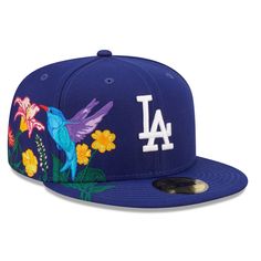 Show off your blossoming love for the Los Angeles Dodgers with this Blooming 59FIFTY hat from New Era. It features a structured build for a timeless look, and the flat bill keeps the sun out of your eyes. Designed with a vibrant, floral design and classic Los Angeles Dodgers details, this fitted cap instantly upgrades any outfit. Blue Flat Bill Baseball Cap For Spring, Blue Flat Bill Hats For Spring, Blue Snapback Hat With Flat Brim For Spring, Blue Flat Brim Snapback Hat For Spring, Blue Flat-brim Snapback Hat For Spring, Multicolor Snapback Hat With Flat Brim For Spring, Multicolor Flat Brim Snapback Hat For Spring, Los Angeles Dodgers Logo, New Era Snapback