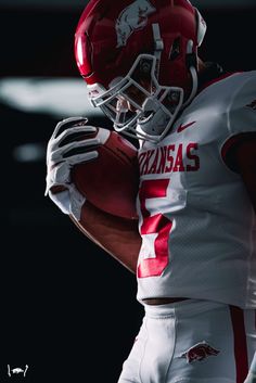 a football player wearing a red and white uniform