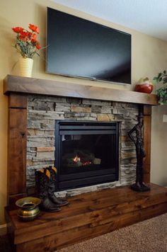 a fireplace with a flat screen tv above it