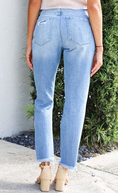 The Distressed Raw Hem Mom Jeans are a chic blend of vintage and contemporary fashion. With their high-rise waist, they offer a comfortable and flattering fit that harks back to the iconic mom jean style. The distressed and raw hem detailing adds a touch of casual, edgy charm, making these jeans a versatile choice for creating a fashion-forward look that exudes confidence and personality. -Mom style jean -High rise -Rise: 11 1/8" -Inseam: 27" -Leg opening: 13" -Distressed detail -Raw hem -100% c Everyday High Rise Distressed Jeans, Dark Wash Mom Fit Straight Leg Cropped Jeans, Dark Wash Straight Leg Mom Fit Cropped Jeans, Dark Wash Mom Fit Cropped Jeans, Dark Wash Cropped Mom Jeans, High Rise Cropped Jeans With Frayed Hem, Distressed Mid-rise Cropped Jeans For Everyday, High Rise Mom Fit Cropped Jeans, Mom Fit Dark Wash Cropped Jeans With Frayed Hem