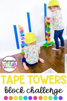 two children playing with tape towers on the floor