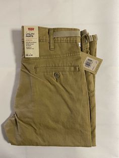 Levi's Straight Fit Cotton Bottoms, Levi's Straight Cotton Bottoms, Levi's Straight Casual Pants, Casual Straight Levi's Pants, Levi's Straight Pants With Pockets, Levi's Slim Fit Straight Leg Bottoms, Fitted Levi's Pants With Pockets, British Khaki, Khaki Pants Men