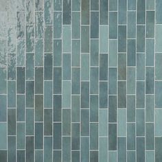 an image of a tile wall that looks like it is made out of blue tiles