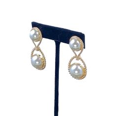 Looking for a unique way to add some flair to your outfit? Look no further than the Imani Double Pearl Clip-On Earrings! These earrings feature a chic geometric design that is sure to turn heads. They're also super versatile, so you can wear them to any occasion. Whether you're dressing up for a night out or just accenting your everyday look, these earrings are a must-have. Plus, they make a great gift! So why wait? Order your pair today! Trendy Teardrop Earrings For Evening, Modern Clip-on Earrings For Party, Clip-on Drop Earrings For Evening, Modern Clip-on Party Earrings, Modern Party Clip-on Earrings, Chic Metal Teardrop Earrings For Formal Occasions, Elegant Metal Plug Earrings, Chic Teardrop Clip-on Earrings For Party, Metal Teardrop Earrings For Evening