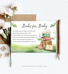 there is a card with books on it next to some flowers and rubber stamps that say, books for baby