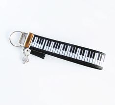 a keychain with a musical keyboard on it