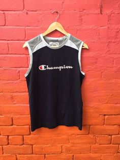 Vintage 90s Champion sleeveless tank top spell-out navy blue white size medium by StateSideVintageUK 70s Glam Rock, Japanese Kimono, Sleeveless Tank Top, Sleeveless Tank, Baseball Tshirts, Heavy Cotton, Vintage 90s, Printed Shirts, Blue White