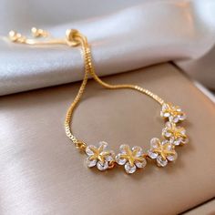 • Material: High Quality 14k gold plated,Cubic Zirconia, 925 Silver• Finish: 14K Gold Feminine Flower Decorated Jewelry, Flower-shaped Cubic Zirconia Bracelets As Gift, Rose Gold Cubic Zirconia Flower Jewelry, Rose Gold Flower Cubic Zirconia Jewelry, Luxury Gold Flower Bracelet, Rose Gold Flower-shaped Cubic Zirconia Jewelry, Flower-shaped Cubic Zirconia Bracelets For Gifts, Flower Shaped Cubic Zirconia Bracelets As Gift, Flower-shaped Cubic Zirconia Bracelet For Gifting