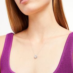 Win her heart with this petite and oh-so-sweet diamond pendant. Created in sterling silver, this darling design showcases a heart-shaped composite of diamonds sparkling in a diamond-lined frame. Radiant with 1/8 ct. t.w. of diamonds and a brilliant buffed luster, this pendant suspends along an 18.0-inch rope chain that secures with a spring-ring clasp. Heart Frame, Diamond Heart, Showcase Design, Rope Chain, Spring Rings, Diamond Pendant, Composition, Diamonds, Sparkle