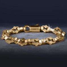 This bracelet is designed to be the perfect match to any outfit. Expertly crafted from premium grade stainless steel with a yellow gold finish. The ornately shaped links are meticulously designed, showcasing detailing that adds a touch of intricacy and luxury. A bracelet that exudes timeless elegance and sophistication. Luxury Stainless Steel Chain Bracelet With Rectangular Links, Modern Gold-tone Stainless Steel Chain Bracelet, Luxury Stainless Steel Box Chain Bracelet, Elegant Metal Gold Bracelet With Box Chain, Elegant Stainless Steel Chain Bracelet With Rectangular Links, Luxury Stainless Steel Chain Bracelet With Solid Links, Elegant Gold Box Chain Bracelet, Luxury Gold Stainless Steel Chain Bracelet, Classic Stainless Steel Link Gold Bracelet