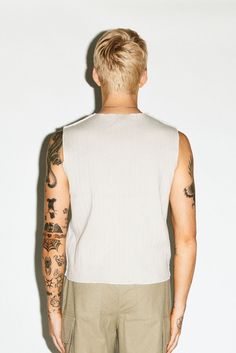 A 90's counter-culture sleeveless muscle tank. Distressed hems, cropped waistband and raw-edge seams add a gritty edge to a minimalist bicep-revealing silhouette. Constructed in an ultra-thick 2-ply ribbed cotton to be worn solo as a statement on its own. Sweatshirt Shirt, Muscle Tank, Muscle Tanks, Body Fit, Raw Edge, Cotton Material, Knitwear, For Men, Sweatshirts