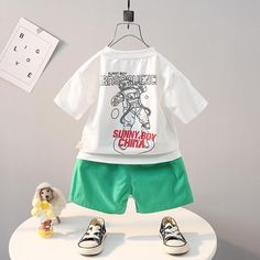 Grow Boy Robot Pattern T-shirt & Front Pocket Shorts - PrettyKid Playful Letter Print Playwear Sets, Playful Summer Sets With Letter Print, Green Cartoon Print Summer Sets, Summer Playful Letter Print Sets, Playful Summer Letter Print Sets, Green Cotton Sets With Cartoon Print, Green Casual Sets With Cartoon Print, Casual Green Sets With Cartoon Print, Playful White Short Sleeve Set