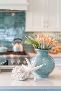 Coastal Kitchen Decor: Fresh Beachy Inspiration Kitchen Coastal Decor, Small Coastal Kitchen Apartment, Ocean Theme Kitchen, Coastal Kitchen Counter Decor Ideas, Coastal Kitchen Counter Decor, Coastal Kitchen Table Decor, Island Centerpiece Ideas, Small Coastal Kitchen, Coastal Dining Table