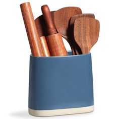 wooden utensils and spoons in a blue cup