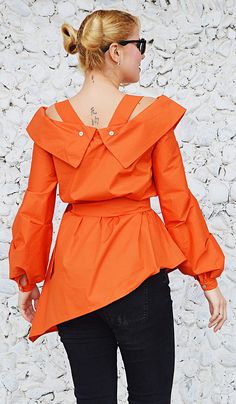 Orange cotton top with long sleeves.Bright wonderful orange tunic. Material 95%cotton, 5% elastane The model in the picture is size S. Can be made in ALL SIZES. If you have any other specific requirements, do not hesitate to contact me! I DO NOT CHARGE EXTRA MONEY for custom made items. All you need to do is send me your measurements. Below, you will find a table with size references. How to get an accurate measurement: * Chest: the circumference, measure the fullest part of your chest ( bra inc Fitted Orange Tops For Work, Fitted Orange Blouse For Work, Fitted Long Sleeve Orange Top, Chic Orange Long Sleeve Blouse, Orange Long Sleeve Blouse For Work, Fitted Orange Blouse For Fall, Chic Orange Cotton Blouse, Fitted Orange Cotton Blouse, Orange Tops For Workwear In Fall