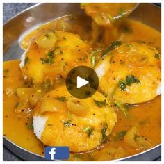 the video is showing how to make chicken and potatoes in a sauce with onions, cheese and parsley