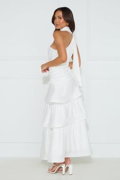 Length from shoulder to hem of size S: 138cm. Chest: 40cm, Waist: 32cm, across front only of size S. Maxi dress. Semi-lined. Model is a standard XS and is wearing size XS. True to size. Non-stretch. One shoulder. Neck wrap. Tiered frill skirt. Crinoline hem. Zipper with hook eye closure. Cold hand wash only. Polyester. We adore the Cara One Shoulder Maxi Dress for all our fancy events. Featuring a neck wrap, a tiered frill skirt and a crinoline hem for a voluminous appearance. Style with heels a One Shoulder Maxi Dress, Frill Skirt, Maxi Dress White, Bridal Shower Dress, Long Bodycon Dress, Maxi Dress Prom, Shower Dresses, Long Sleeve Lace Dress, Neck Wrap