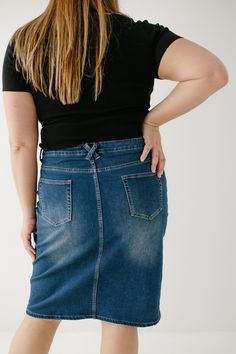 Every modest denim collection needs a classic no-fuss dark wash denim skirt! The 'Scout' denim skirt features a simple design, a modest knee-length, and working pockets for life on the go! The knit denim with belt loops ensures a flattering fit for a variety of body types. Style with a graphic tee and sneakers for an effortless vibe. Perfect for your everyday activities or traveling the world! Exclusively designed by us, for you! 85% Cotton 10% Polyester 5% Spandex Wash Cold Gentle Cycle Hang to Medium Wash Denim Pencil Skirt With Pockets, Dark Wash Denim Pencil Skirt With Pockets, Everyday Dark Wash Bottoms With Pockets, Casual Dark Wash Denim Pencil Skirt, Spring Denim Bottoms For Everyday Use, Denim Bottoms For Everyday Spring Use, Everyday Medium Wash Denim Skirt, Everyday Dark Wash Denim Skirt, Fitted Dark Wash Denim Skirt For Everyday