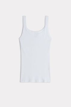 Racerback vest top in Supima® cotton. Designed to be worn as underwear or outerwear. Soft and comfortable. Basic Seamless Tank Top, White Ribbed Scoop Neck Tank Top, Classic Scoop Neck Tank Top For Spring, White Cotton Ribbed Tank Top, White Sleeveless Ribbed Tank Top, Classic Seamless Everyday Tank Top, Basic Everyday Seamless Tank Top, White Ribbed Sleeveless Tank Top, Classic Everyday Seamless Tank Top