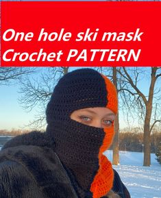 a woman wearing a black and orange knitted ski mask with the words one hole ski mask crochet pattern over her face