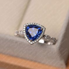 This ring features a 8*8 mm trillion cut lab sapphire. Customization is available. It is made by hand, and it will take about 7 days to finish the ring after your payment is completed. Main stone: 8*8 mm trillion cut lab sapphire Main stone weight: 2.48 ct Metal type: sterling silver /14k gold Accent stone: cz Customization is available, just fee free to contact me, it is free to engrave inside the ring, it is free, you can leave a ntoe with your order, but it will be great no more than 15 lette September Birthstone Ring, Original Engagement Rings, Saphir Ring, September Birthstone Rings, Gemstone Ring Silver, Blue Gemstone Rings, White Sapphire Ring, London Blue Topaz Ring, White Gold Engagement Ring