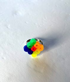 These rings are great for kids. They are colorful and playful.  They come in a gift bag. (Colors vary. If you would like a specific color, please send me a message). They are made of plastic beads. The colors green, blue, orange, yellow and pink. Rings For Kids, Fun Rings, Diamond Shape Earrings, Yellow And Pink, Colors Green, Green Diamond, Rings Cool, Plastic Beads, Orange Yellow