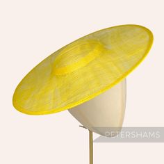 *This is not a fitted hat! You will need to attach a headband, comb or elastic to secure it to your head* This yellow cartwheel hat base is a classic shape that has sprung into popularity in the past year. Made from 2 layers of stiffened sinamay, these cartwheels are ready to trim and are fitted with a petersham ribbon on the inside crown edge. Simply add a comb or headband to secure to the head. Hat base measures: Width: 35.5cm (14 inches) Crown Width: 13.5cm (5.3 inches) Crown Height: Approxim Adjustable Straw Hat With Structured Crown For Spring, Adjustable High Crown Straw Hat For Spring, Adjustable Straw Hat With Structured Crown For Kentucky Derby, Adjustable Structured Crown Straw Hat For Kentucky Derby, Adjustable Top Hat With Structured Crown For Church, Fitted High Crown Straw Hat For Summer, Yellow Straw Hat With Curved Brim, Adjustable Curved Brim Boater Hat For Royal Ascot, Adjustable Curved Brim Boater Hat For Church