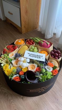 a round box filled with lots of different fruits and vegetables